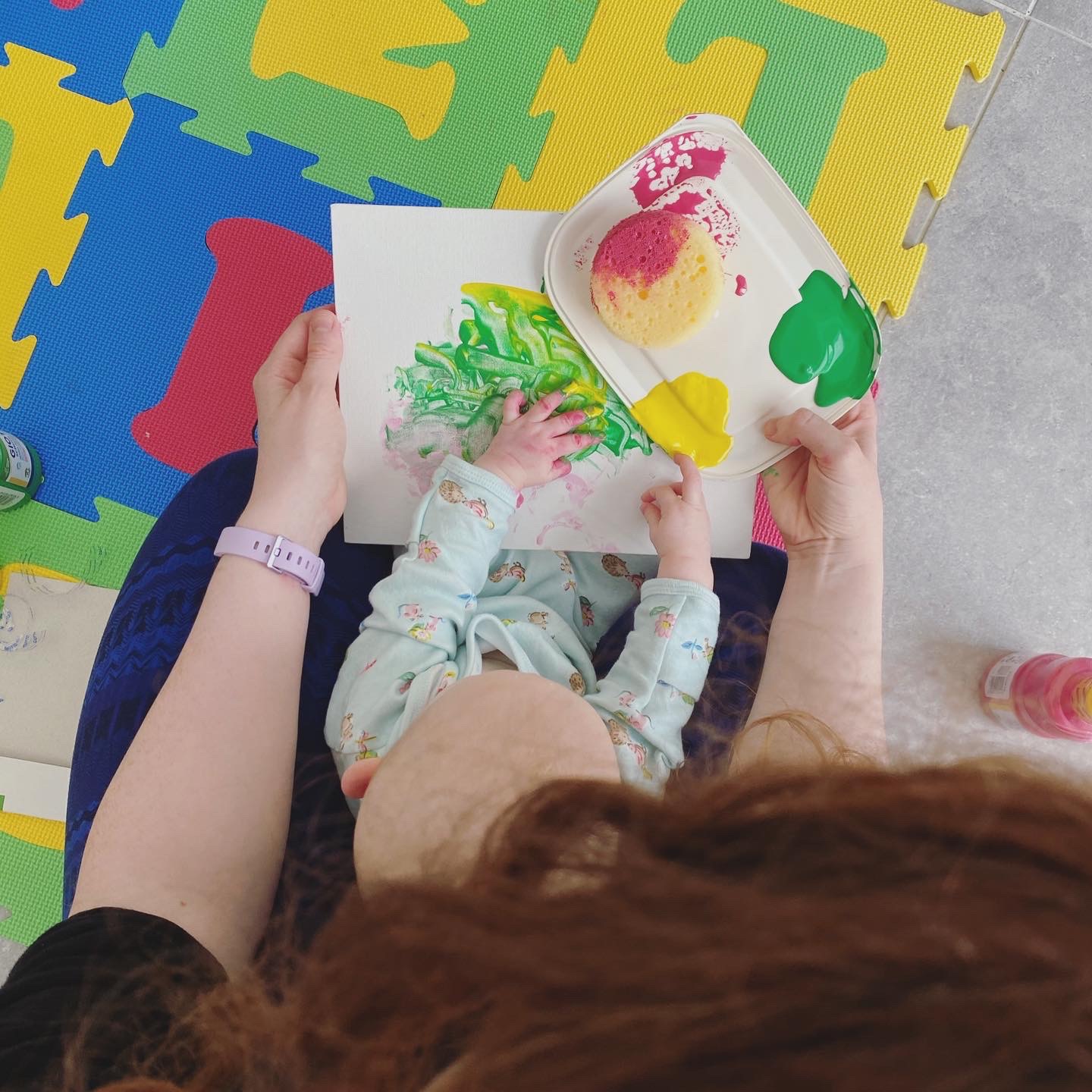 Mum and small baby painting together
